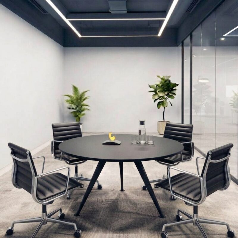 Apollo meeting table with a natural wood and black metal leg finish inside a corporate boardroom in Dubai.