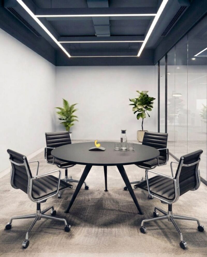 Apollo meeting table with a natural wood and black metal leg finish inside a corporate boardroom in Dubai.